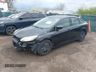 2012 Ford Focus SE with VIN 1FAHP3F27CL112277, listed as a IAAI auction lot 42053243 with 104,885 mi miles. Bid and sale history available at carsss.com. Image 2.