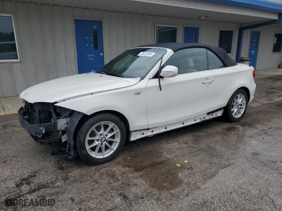 2011 BMW 1 Series 128i with VIN WBAUN1C5XBVH82605, listed as a Copart auction lot 73457334 with 94,969 mi miles and Salvage Title. Bid and sale history available at carsss.com. Image 1.