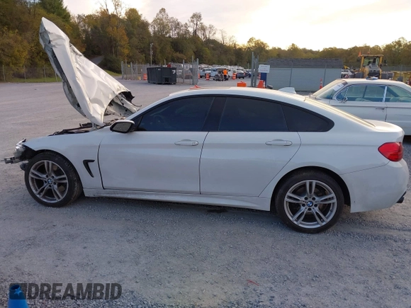 2015 BMW 4 Series 428i xDrive z VIN WBA4C9C57FD330866, wystawiony jako IAAI lot #40574326 z przebiegiem 123 726 mil mil oraz . Historia ofert i sprzedaży dostępna na DreamBid. Obrazek 14.