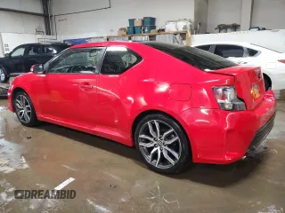 2014 Scion tC z VIN JTKJF5C71E3072025, wystawiony jako Copart lot #51967285 z przebiegiem 187 091 mil mil oraz Szkody całkowita. Historia ofert i sprzedaży dostępna na DreamBid. Obrazek 2.