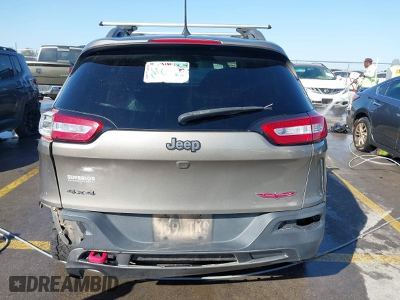 2017 Jeep Cherokee Trailhawk L Plus with VIN 1C4PJMBB6HW654172, listed as a IAAI auction lot 41851236 with 104,263 mi miles. Bid and sale history available at carsss.com. Image 16.