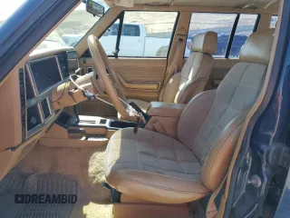 1987 Jeep Cherokee with VIN 1JCMT7842HT114597, listed as a Copart auction lot 49319945 with 230,675 mi miles and Clean title. Bid and sale history available at DreamBid. Image 7.
