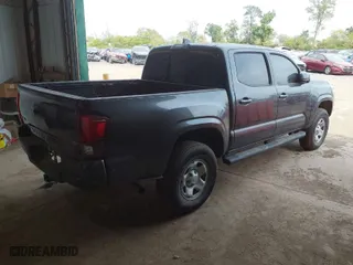 2019 Toyota Tacoma 4WD SR with VIN 3TMCZ5AN5KM204187, listed as a IAAI auction lot 40318136 with 105,409 mi miles. Bid and sale history available at carsss.com. Image 4.