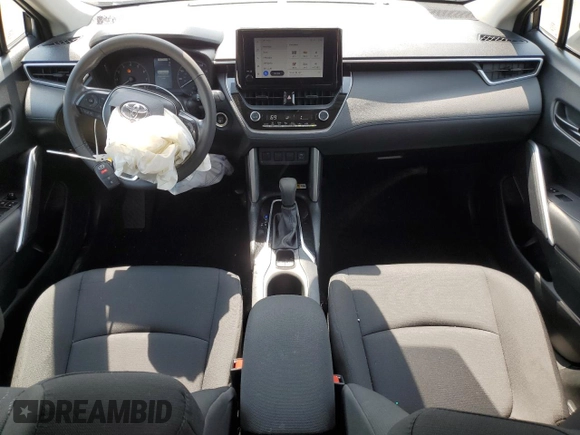 2023 Toyota Corolla Cross LE with VIN 7MUCAABG4PV054828, listed as a Copart auction lot 59466855 with 23,884 mi miles and Salvage title. Bid and sale history available at DreamBid. Image 8.