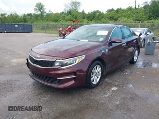 2016 Kia Optima LX with VIN 5XXGT4L32GG105361, listed as a IAAI auction lot 42066431 with 61,026 mi miles. Bid and sale history available at carsss.com. Image 2.