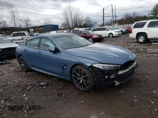 2020 BMW 8 Series 840i with VIN WBAGV4C00LCD53148, listed as a Copart auction lot 38031863 with 61,742 mi miles. Bid and sale history available at carsss.com. Image 4.