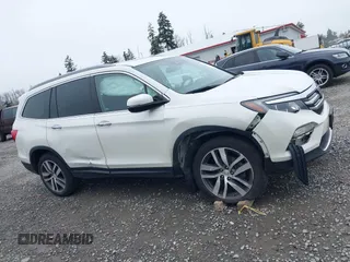 2017 Honda Pilot Elite with VIN 5FNYF6H06HB096156, listed as a IAAI auction lot 41771161 with 73,889 mi miles and . Bid and sale history available at DreamBid. Image 13.