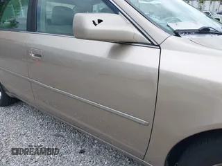 2001 Toyota Avalon XL z VIN 4T1BF28B71U192791, wystawiony jako IAAI lot #42180729 z przebiegiem 132 397 mil mil oraz . Historia ofert i sprzedaży dostępna na DreamBid. Obrazek 15.