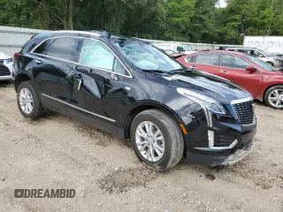 2023 Cadillac XT5 FWD Luxury z VIN 1GYKNAR40PZ106096, wystawiony jako Copart lot #80909074 z przebiegiem 19 677 mil mil oraz Nie do naprawy • Non repairable. Historia ofert i sprzedaży dostępna na DreamBid. Obrazek 4.
