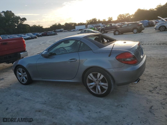 2009 Mercedes-Benz SLK-Class 3.5L with VIN WDBWK58F19F191589, listed as a Copart auction lot 75384764 with 151,445 mi miles and Salvage Title. Bid and sale history available at carsss.com. Image 2.