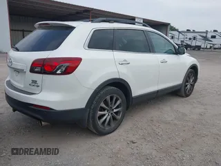 2015 Mazda CX-9 Grand Touring with VIN JM3TB2DA7F0448886, listed as a IAAI auction lot 42440203 with 108,765 mi miles and . Bid and sale history available at DreamBid. Image 4.