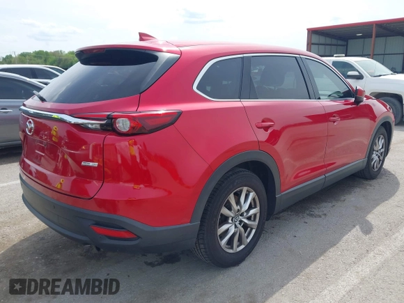 2016 Mazda CX-9 Touring with VIN JM3TCACY4G0112961, listed as a IAAI auction lot 42094718 with 114,679 mi miles and . Bid and sale history available at DreamBid. Image 4.
