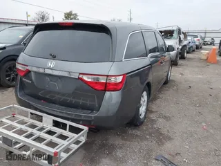 2013 Honda Odyssey LX with VIN 5FNRL5H24DB042230, listed as a IAAI auction lot 40954067 with 212,154 mi miles. Bid and sale history available at carsss.com. Image 4.