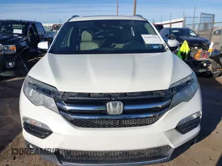 2017 Honda Pilot Touring with VIN 5FNYF6H93HB056387, listed as a IAAI auction lot 41095336 with 90,376 mi miles and . Bid and sale history available at DreamBid. Image 12.