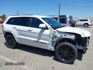 2018 Jeep Grand Cherokee Altitude with VIN 1C4RJEAG2JC404009, listed as a IAAI auction lot 42691304 with 60,948 mi miles and . Bid and sale history available at DreamBid. Image 14.