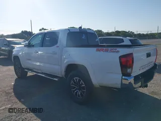 2018 Toyota Tacoma SR with VIN 5TFAX5GN2JX128621, listed as a IAAI auction lot 41797514 with 216,251 mi miles and . Bid and sale history available at DreamBid. Image 3.