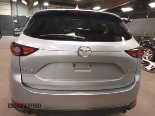 2021 Mazda CX-5 Grand Touring with VIN JM3KFBDM7M1392644, listed as a IAAI auction lot 41824612 with 80,000 mi miles and . Bid and sale history available at DreamBid. Image 15.