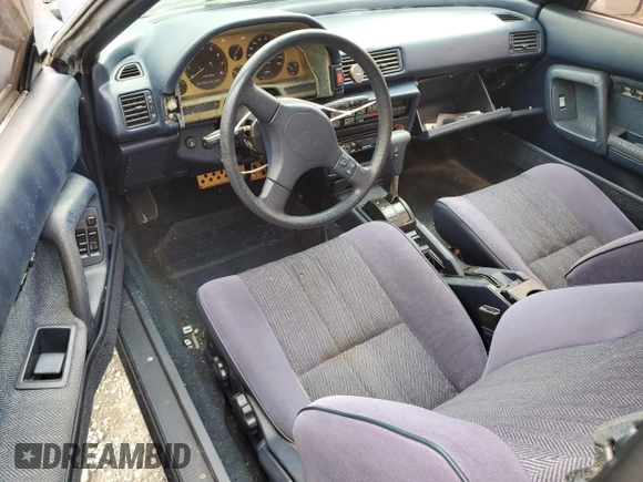 1988 Toyota Celica z VIN JT2ST67L0J7222767, wystawiony jako Copart lot #53647155 z przebiegiem 103 345 mil mil oraz Czysty tytuł • Clean title. Historia ofert i sprzedaży dostępna na DreamBid. Obrazek 8.