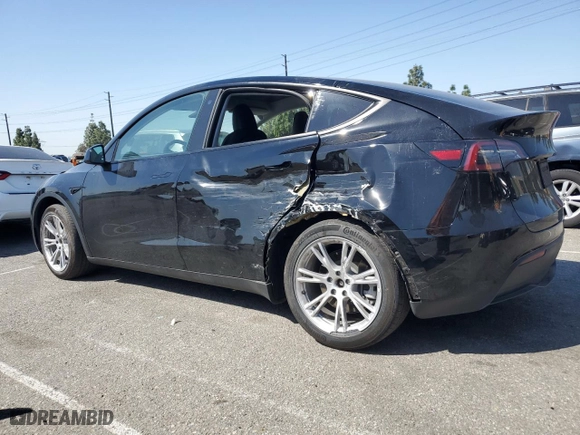 2023 Tesla Model Y Long Range with VIN 7SAYGDEE9PA080811, listed as a Copart auction lot 52088055 with 23,130 mi miles and Salvage Title. Bid and sale history available at carsss.com. Image 2.