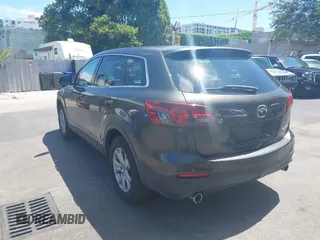 2015 Mazda CX-9 Touring z VIN JM3TB2CV1F0458995, wystawiony jako IAAI lot #42523344 z przebiegiem 130 763 mil mil oraz . Historia ofert i sprzedaży dostępna na DreamBid. Obrazek 3.