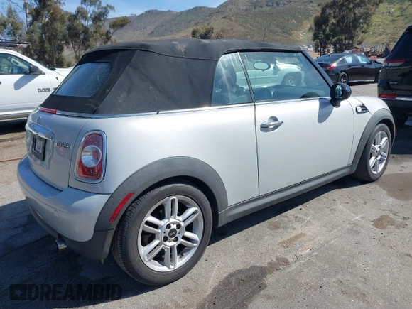 2011 MINI Convertible with VIN WMWZN3C57BT133094, listed as a IAAI auction lot 41711094 with 96,056 mi miles and . Bid and sale history available at DreamBid. Image 4.