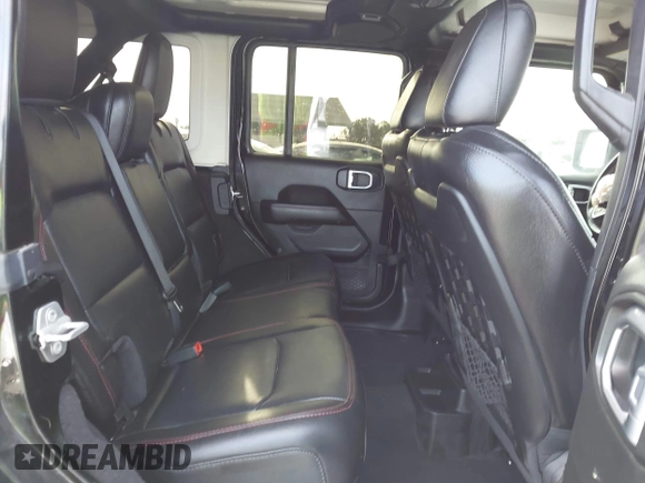 2020 Jeep Wrangler Unlimited Rubicon with VIN 1C4HJXFG1LW141335, listed as a IAAI auction lot 42724973 with 59,843 mi miles and . Bid and sale history available at DreamBid. Image 8.