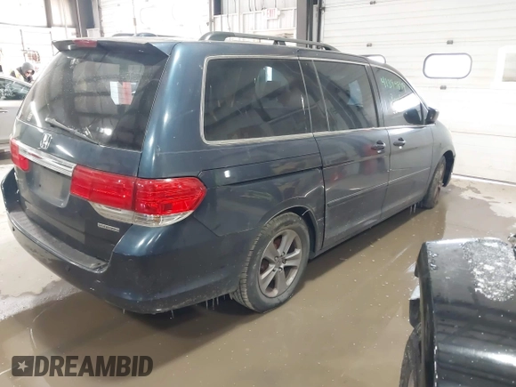 2010 Honda Odyssey Touring with VIN 5FNRL3H98AB095042, listed as a IAAI auction lot 41394894 with 254,525 mi miles. Bid and sale history available at carsss.com. Image 4.