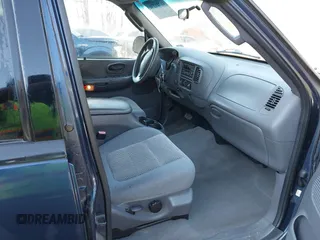 2002 Ford F-150 XLT with VIN 1FTRW086X2KE17566, listed as a IAAI auction lot 41721236 with 98,524 mi miles. Bid and sale history available at carsss.com. Image 5.