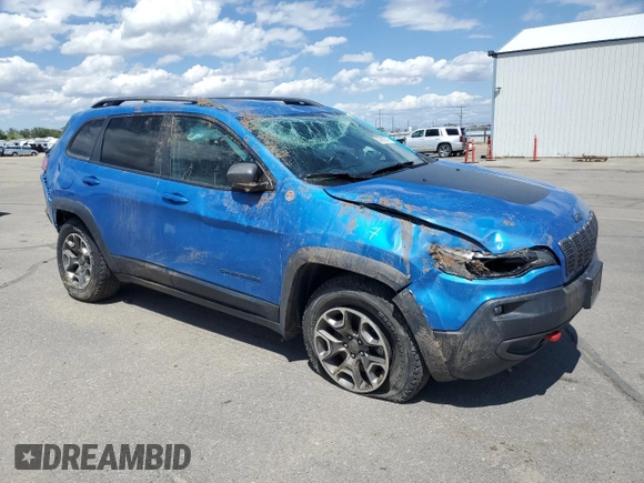 2021 Jeep Cherokee Trailhawk with VIN 1C4PJMBXXMD110436, listed as a Copart auction lot 57829375 with 46,647 mi miles and Salvage title. Bid and sale history available at DreamBid. Image 4.