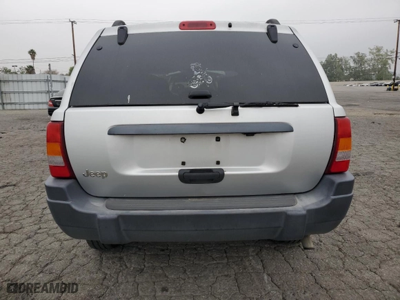2004 Jeep Grand Cherokee Laredo with VIN 1J4GX48S64C151124, listed as a Copart auction lot 52669445 with 152,970 mi miles and Salvage Title. Bid and sale history available at carsss.com. Image 6.