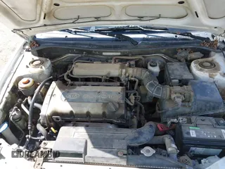 2001 Kia Sephia z VIN KNAFB121815044460, wystawiony jako IAAI lot #41846087 z przebiegiem 294 862 mil mil oraz . Historia ofert i sprzedaży dostępna na DreamBid. Obrazek 10.