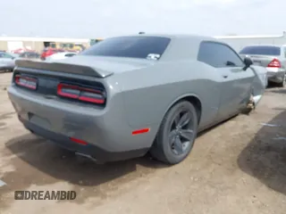 2018 Dodge Challenger SXT z VIN 2C3CDZAG9JH229506, wystawiony jako IAAI lot #41915902 z przebiegiem 145 486 mil mil oraz . Historia ofert i sprzedaży dostępna na DreamBid. Obrazek 4.
