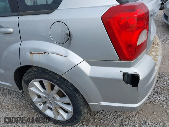 2011 Dodge Caliber Heat with VIN 1B3CB5HA0BD237473, listed as a IAAI auction lot 41690622 with 205,961 mi miles and . Bid and sale history available at DreamBid. Image 6.