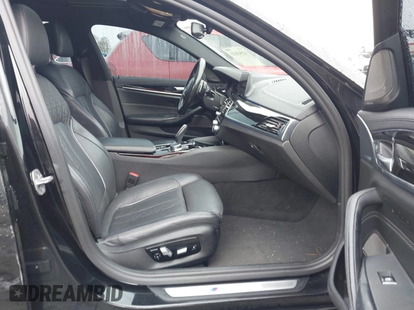 2018 BMW 5 Series M550i xDrive with VIN WBAJB9C59JB049114, listed as a IAAI auction lot 41543633 with 87,942 mi miles and . Bid and sale history available at carsss.com. Image 5.