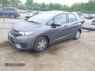 2015 Honda Fit LX with VIN 3HGGK5H58FM722880, listed as a IAAI auction lot 42276261 with 104,886 mi miles and . Bid and sale history available at DreamBid. Image 2.
