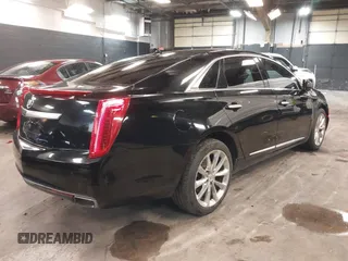 2013 Cadillac XTS Luxury z VIN 2G61R5S34D9102625, wystawiony jako IAAI lot #41668752 z przebiegiem 112 065 mil mil oraz . Historia ofert i sprzedaży dostępna na DreamBid. Obrazek 4.