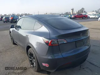 2023 Tesla Model Y Long Range with VIN 7SAYGDEE7PA196038, listed as a IAAI auction lot 41459601 with 16,489 mi miles and . Bid and sale history available at DreamBid. Image 3.