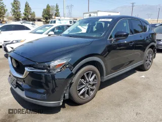 2018 Mazda CX-5 Grand Touring with VIN JM3KFBDM4J0348165, listed as a Copart auction lot 62733665 with 80,693 mi miles and Salvage title. Bid and sale history available at DreamBid. Image 1.