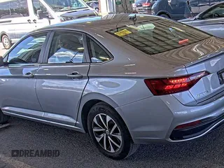 2024 Volkswagen Jetta S with VIN 3VW5M7BU8RM051840, listed as a IAAI auction lot 42852799 with 14,434 mi miles and . Bid and sale history available at DreamBid. Image 2.