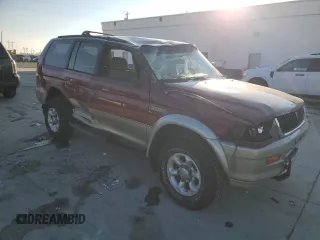 1999 Mitsubishi Montero Sport LS with VIN JA4MT31H2XP002911, listed as a Copart auction lot 89133235 with 209,624 mi miles and Salvage Title. Bid and sale history available at carsss.com. Image 4.