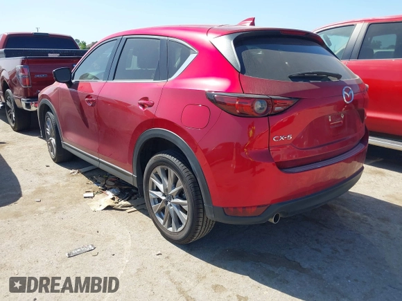 2021 Mazda CX-5 Grand Touring with VIN JM3KFADM4M0476615, listed as a IAAI auction lot 42004814 with 42,483 mi miles. Bid and sale history available at carsss.com. Image 3.