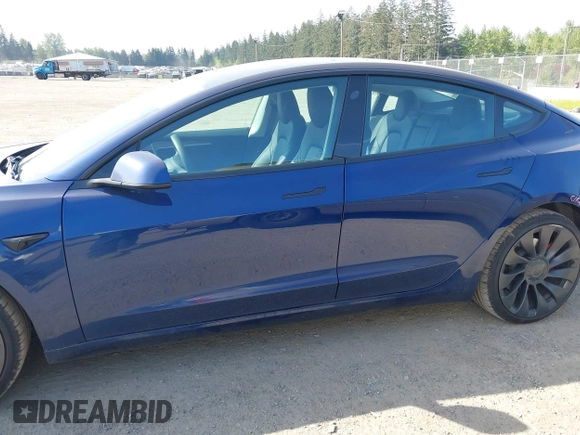 2023 Tesla Model 3 Performance with VIN 5YJ3E1EC2PF679613, listed as a IAAI auction lot 42099199 with 21,721 mi miles. Bid and sale history available at carsss.com. Image 15.