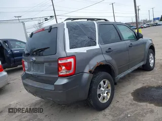 2009 Ford Escape XLT with VIN 1FMCU03G59KB04202, listed as a IAAI auction lot 41919819 with 111,730 mi miles. Bid and sale history available at carsss.com. Image 4.