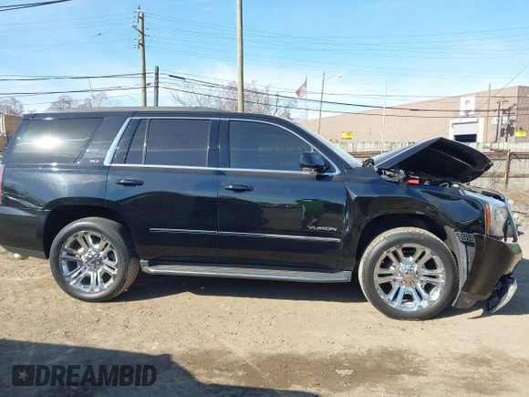2016 GMC Yukon SLT with VIN 1GKS2BKC5GR253038, listed as a IAAI auction lot 41790030 with 101,039 mi miles. Bid and sale history available at carsss.com. Image 13.