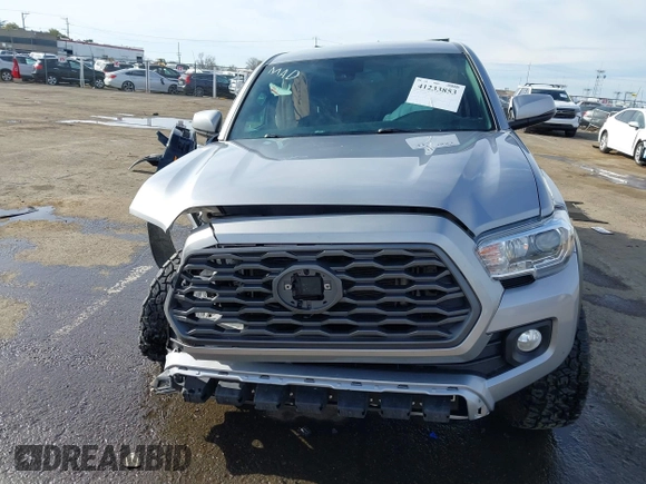 2021 Toyota Tacoma 4WD SR5 with VIN 3TMDZ5BN1MM105694, listed as a IAAI auction lot 41233853 with 1 mi miles. Bid and sale history available at carsss.com. Image 12.