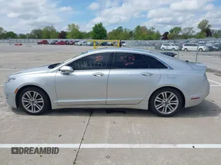 2015 Lincoln MKZ z VIN 3LN6L2GK5FR622117, wystawiony jako IAAI lot #42164455 z przebiegiem 167 156 mil mil oraz . Historia ofert i sprzedaży dostępna na DreamBid. Obrazek 14.