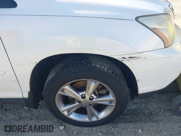 2007 Lexus RX 400h z VIN JTJGW31U472002782, wystawiony jako IAAI lot #41763035 z przebiegiem 228 650 mil mil oraz . Historia ofert i sprzedaży dostępna na DreamBid. Obrazek 12.