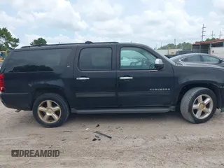 2011 Chevrolet Suburban LT with VIN 1GNSCJE07BR128885, listed as a IAAI auction lot 42456748 with 201,789 mi miles and . Bid and sale history available at DreamBid. Image 13.