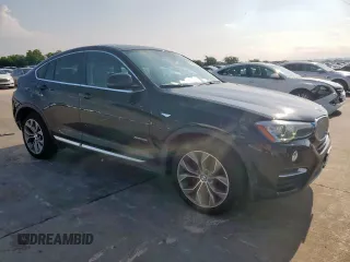 2015 BMW X4 xDrive28i with VIN 5UXXW3C52F0M87621, listed as a Copart auction lot 59176505 with 163,727 mi miles and Salvage title. Bid and sale history available at DreamBid. Image 4.
