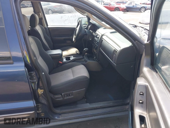 2004 Jeep Grand Cherokee with VIN 1J4GX48J74C283123, listed as a IAAI auction lot 42477393 with 182,491 mi miles and . Bid and sale history available at DreamBid. Image 5.